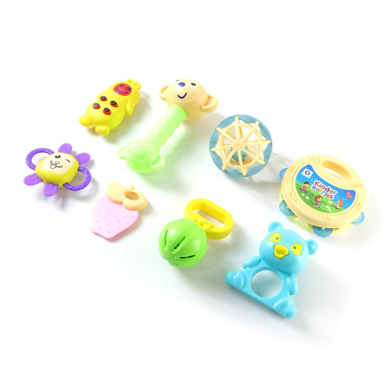 Happy baby playing with a blue and green rattle, stimulating early development.
