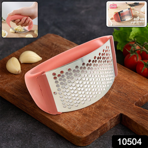 Close-up of stainless steel pressing surface of garlic press crusher