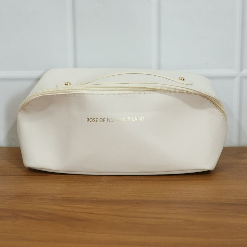 Open travel organizer pouch displaying internal compartments for toiletries