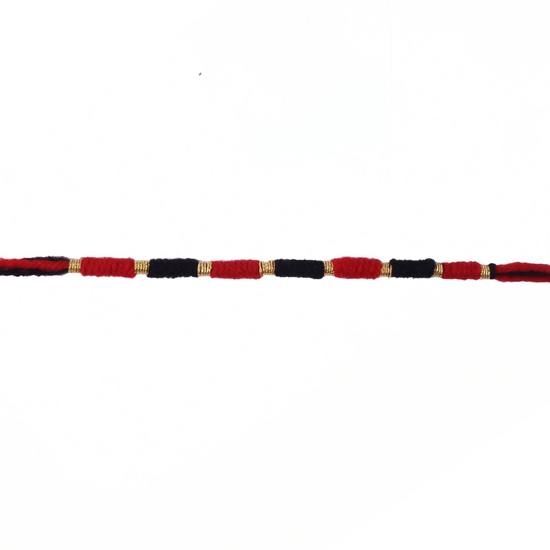 Red and black thread Rakhi with detailed craftsmanship