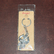 Metal keychain displaying detailed craftsmanship of Trishul and Damru symbols
