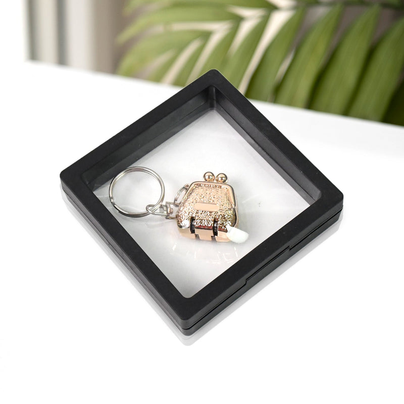 Nail clipper with unique floating keychain frame for easy portability