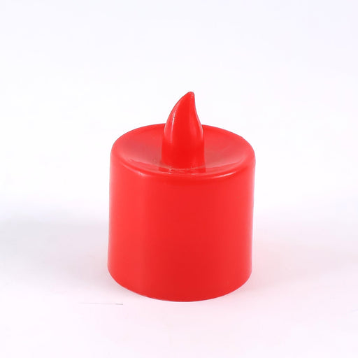 Hand holding a red battery operated LED tea light, demonstrating its portable size.