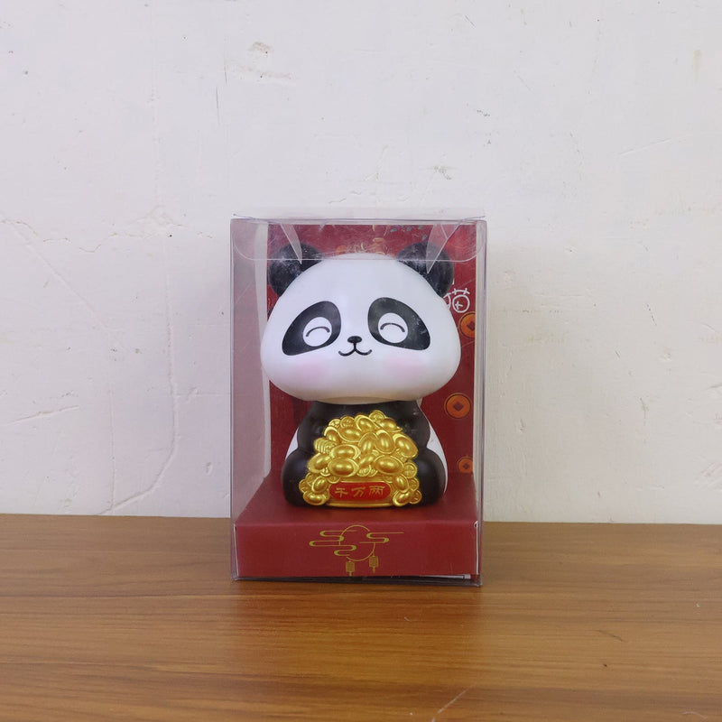 Multiple solar panda figurines in various poses, emphasizing their charm as car interior accessories.