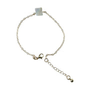 Detailed view of square stone charm on adjustable chain bracelet