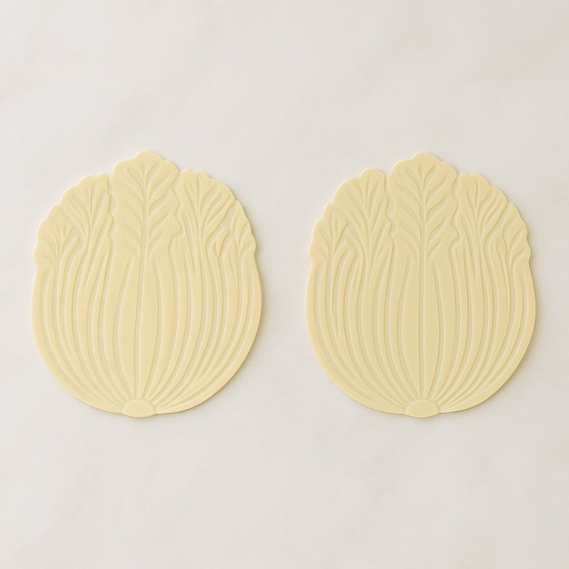 Silicone leaf coaster protecting surface from heat and moisture with hot beverage