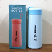 Compact plastic water bottle with blue lid and white body for travel