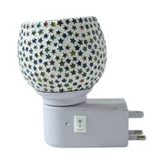 Warm glowing star pattern mosaic glass night lamp creating cozy ambience