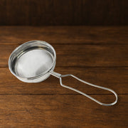 Ergonomic handle and hanging hook feature of stainless steel tea strainer