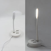 Compact Portable USB Fan and light connected to a power source.
