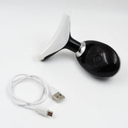 The portable Neck Face Massager shown with its USB charging cable.