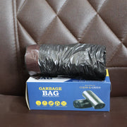 Neatly stored roll of heavy duty garbage bags, ideal for small spaces.