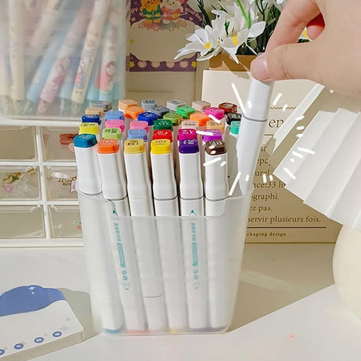 A clear plastic drawer organizer in a bathroom drawer, holding toiletries.
