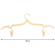 Close-up of dual clips on an adjustable folding clothes hanger
