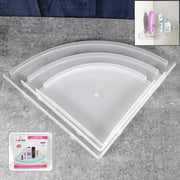 Three-piece white plastic corner shelf set displayed in a modern bathroom.
