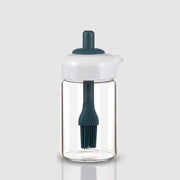 Glass oil dispenser with a brush, ideal for grilling, baking, or general cooking.