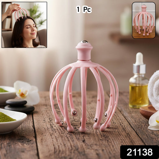 Person using a manual scalp massager with rolling ball tips for relaxation.