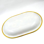 Multiple plastic serving trays stacked, highlighting their compact storage.
