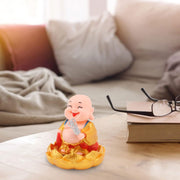 The peaceful expression of the Solar Buddha Car Ornament, ideal for dashboard decoration.