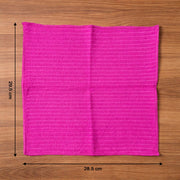 Microfiber cleaning cloth in use wiping a smooth surface