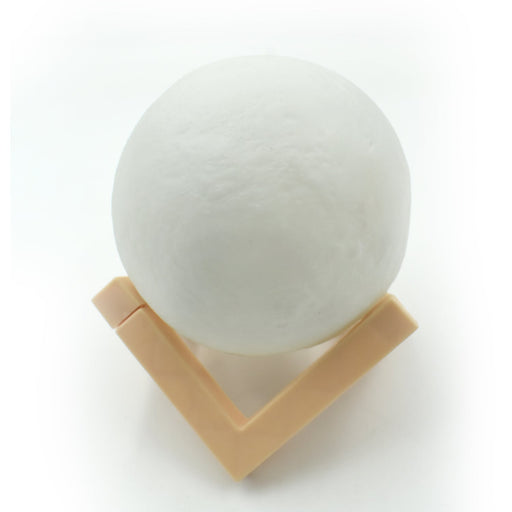 Close-up of the 3D moon lamp showcasing its detailed surface and touch sensor.