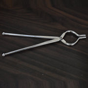 Ganesh 8mm stainless steel tongs, ideal for holding hot utensils, shown from a side angle.