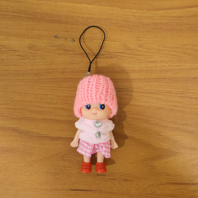 Vibrant outfit of mini doll keychain in colorful setting