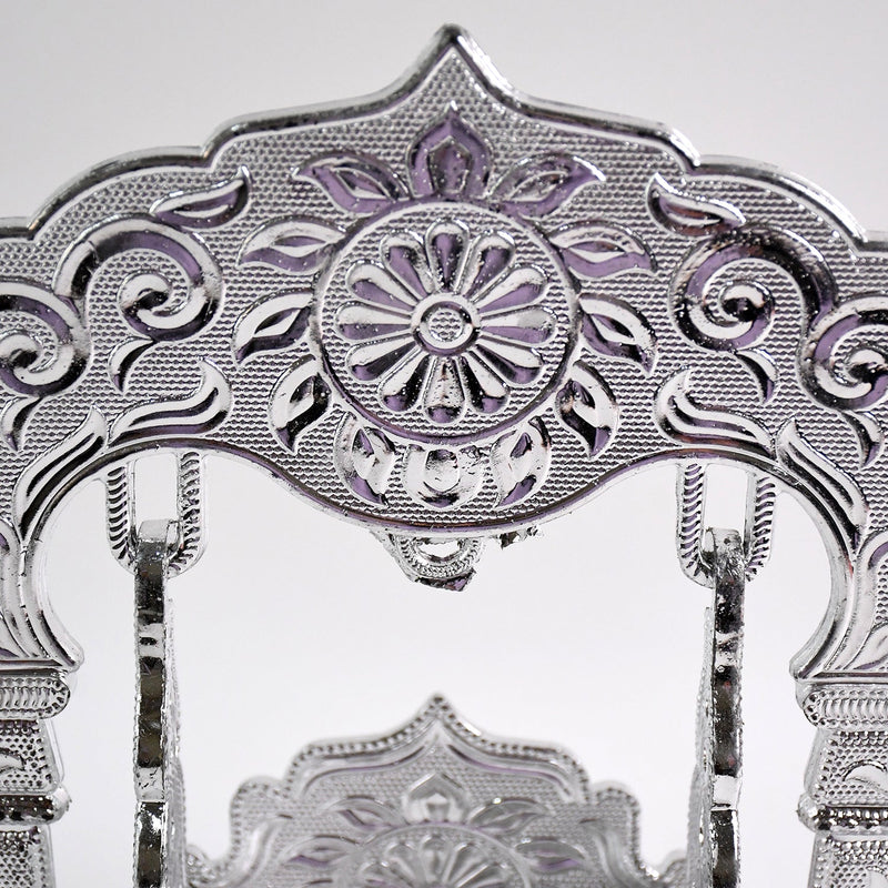 Elegant silver-coated Bal Gopal Jhula enhancing pooja room décor