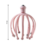 Side view of the manual scalp massager, highlighting its compact design.