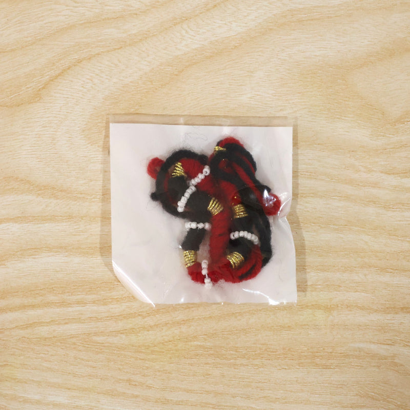 Festive red and black thread rakhi for brother with golden accents