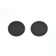 Various sizes of brown felt furniture pads laid out for floor scratch prevention.