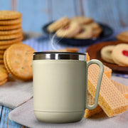 The Ganesh coffee mug showcasing its durable stainless steel construction.