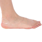 Demonstration of a heel protector preventing a foot from slipping out of a loose shoe.