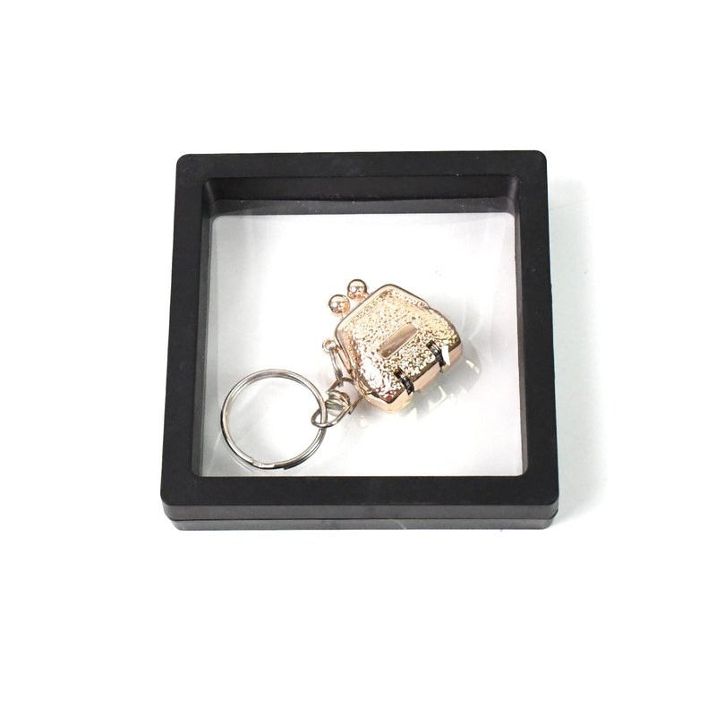 Mini nail clipper keychain in clear showcase with 3D floating effect
