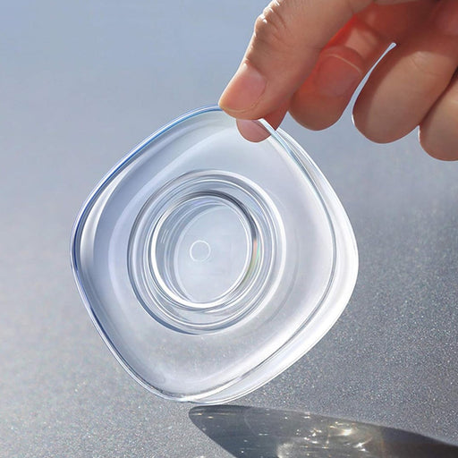 Nano gel pad securely holding a mobile phone on a car dashboard.