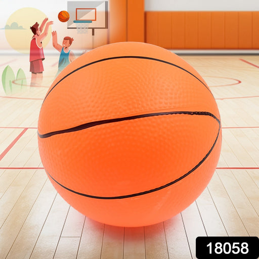 A child's hand holding the high-bouncing mini basketball on a playground.