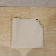 Person wearing waterproof apron while cooking in kitchen