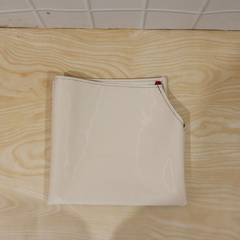 Person wearing waterproof apron while cooking in kitchen