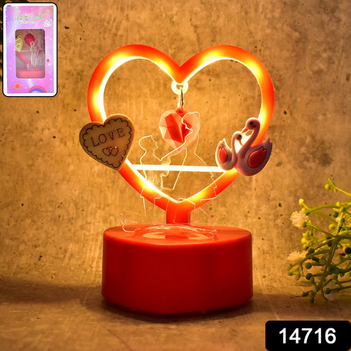 Close-up of heart LED showpiece on table creating romantic ambiance
