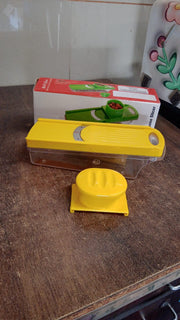 Close-up of vegetable slicer blade and yellow ABS plastic handle