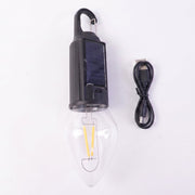 Close-up of vintage warm LED filament bulb in camping lantern