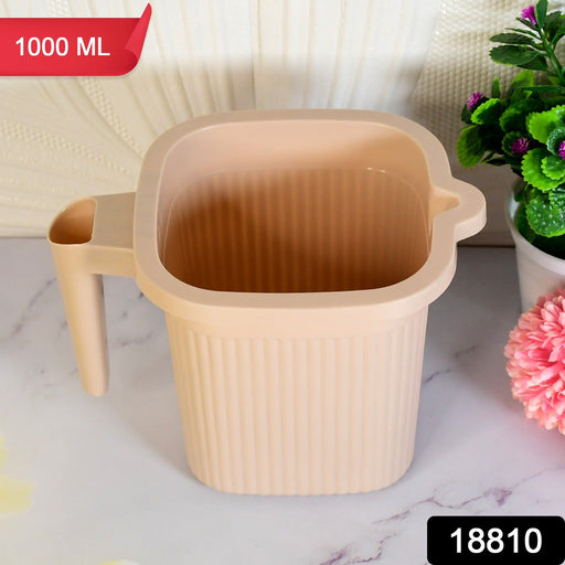 Transparent Plastic Bath Mug with a sturdy handle, ideal for daily use.