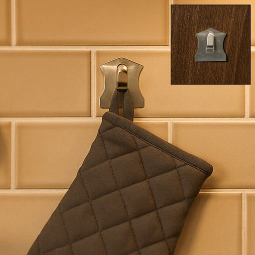 A set of sleek stainless steel wall hooks applied to a smooth, tiled surface.