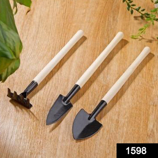 Close-up of a vibrant children's gardening kit featuring a trowel, shovel, and rake.