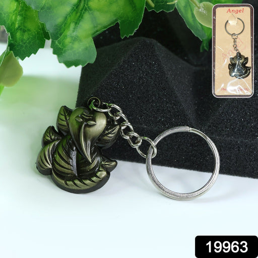 Close-up details of Ganesh Face on antique black metal keychain