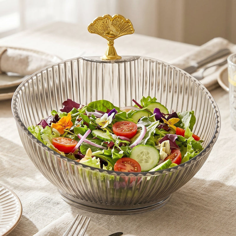 Fruit bowl with gold accent enhancing dining decor with fresh fruits
