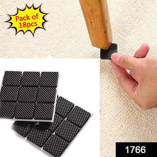 Close-up of a square self-adhesive furniture pad applied to a chair leg.