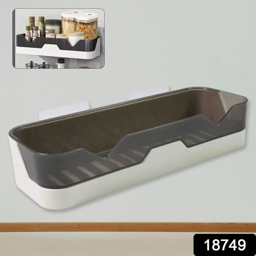 Close-up of the plastic adhesive shower caddy, highlighting its spacious design.