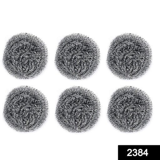 Heavy-duty stainless steel scrubber tackling tough grease on utensils.