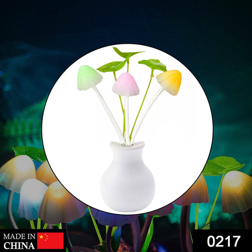 Close-up of a vibrant multicolor mushroom night light with artificial flowers.
